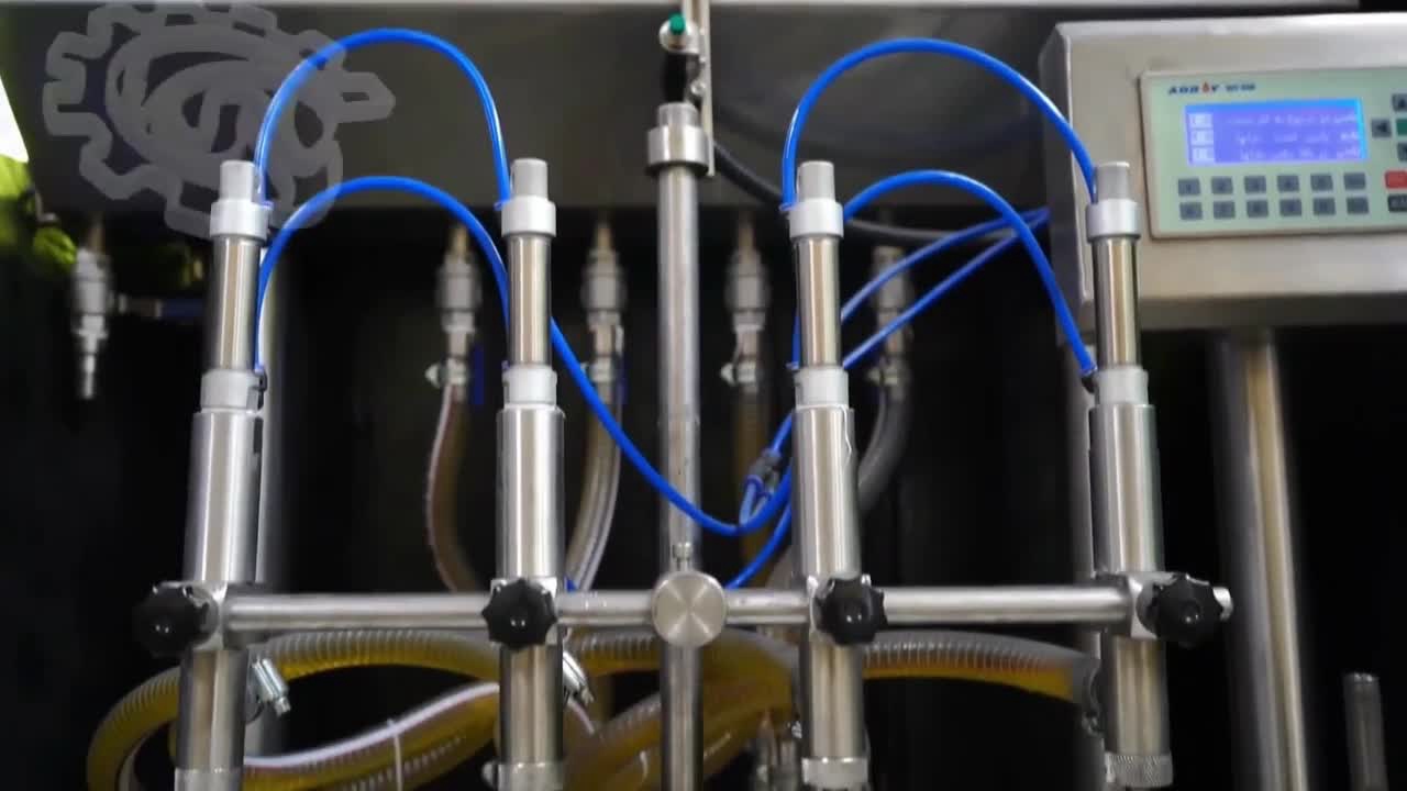 دستگاه پرکن ۴ نازل نیمه اتوماتیک مایعات غلیظ و رقیق
